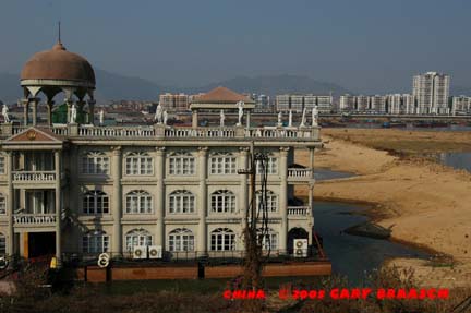 Floating restaurant, 'Imperial Palace by the Sea' now high and dry in expance of sand in shrinking North River, at Qingyuan City north of Guangzhou -- experiencing severe drought