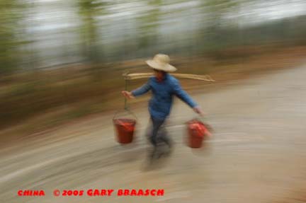 Woman carries water
